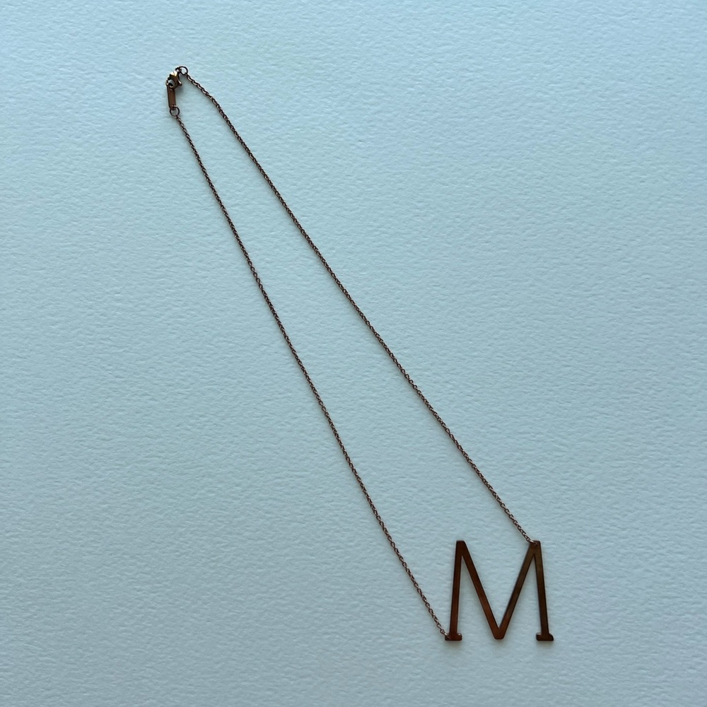 Letter M necklace in rose gold tone chain